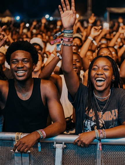 Attendees cheering at a live event